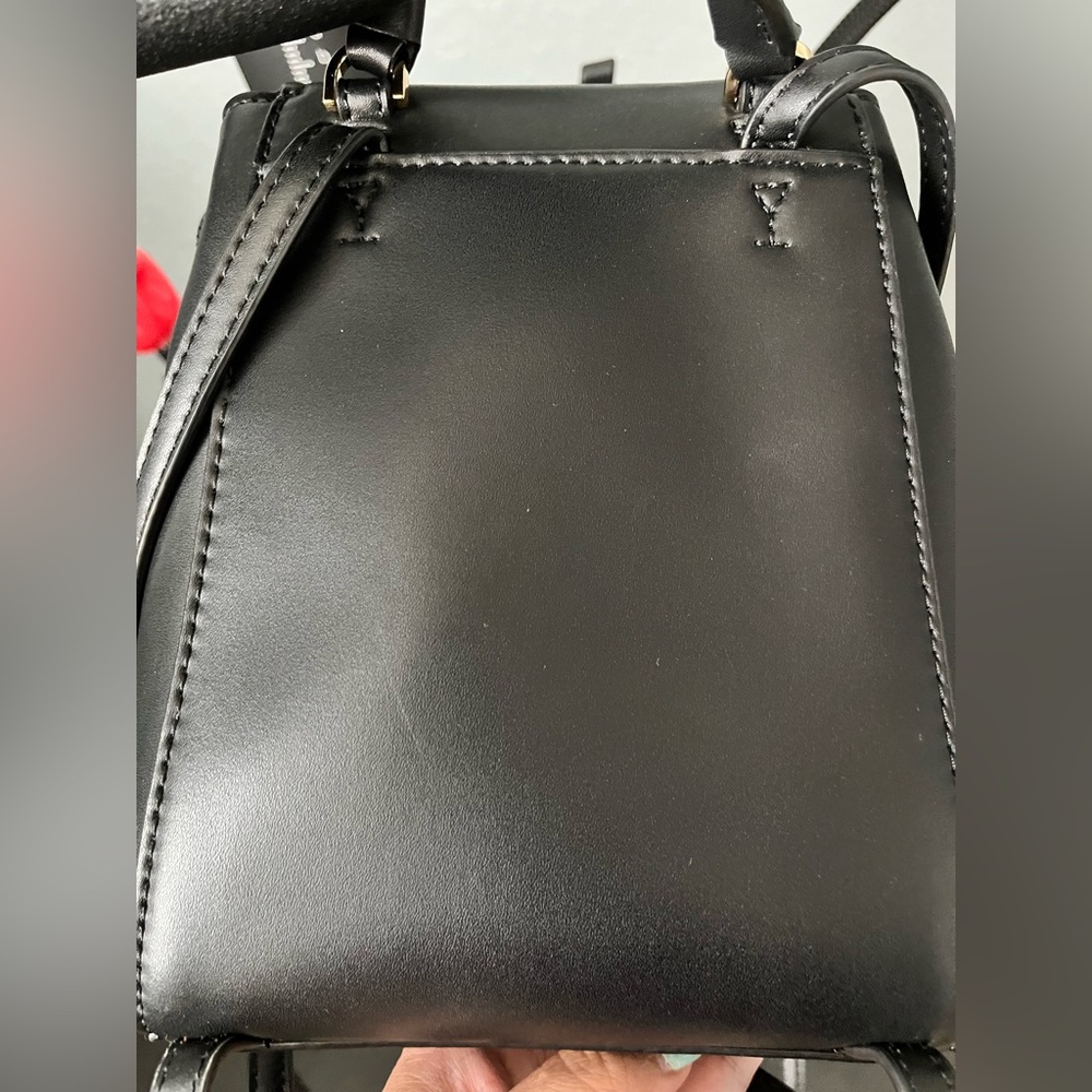 Slightly loved mini MK backpack